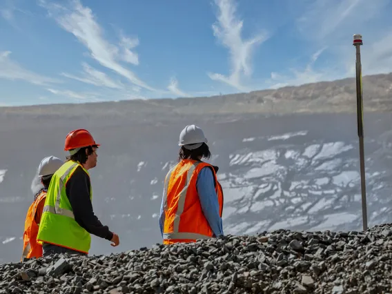 Mine workers in front of a slope