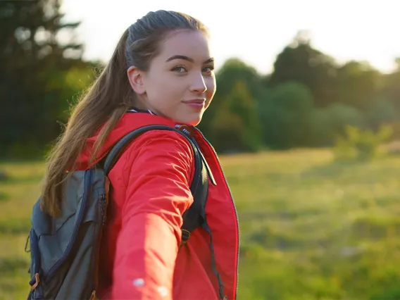 Young woman looking back over her shoulder