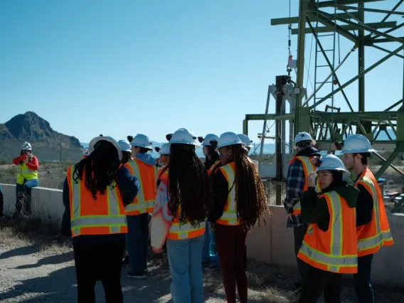 Students with mining gear at a mine