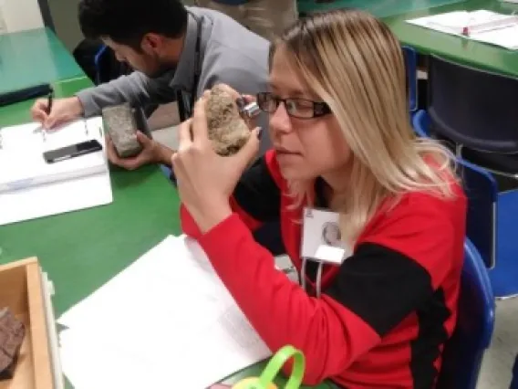 Person identifying a rock