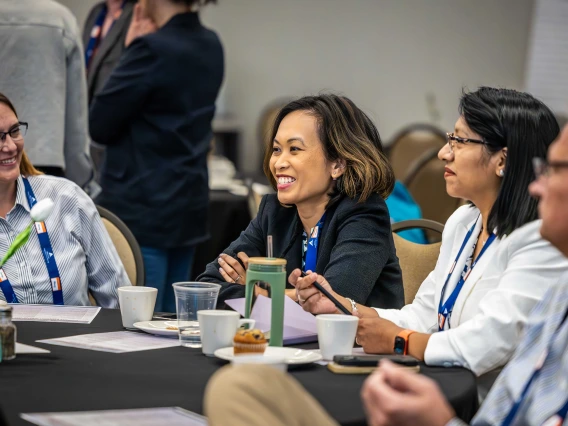 attendee smiling at Mining Social License Summit