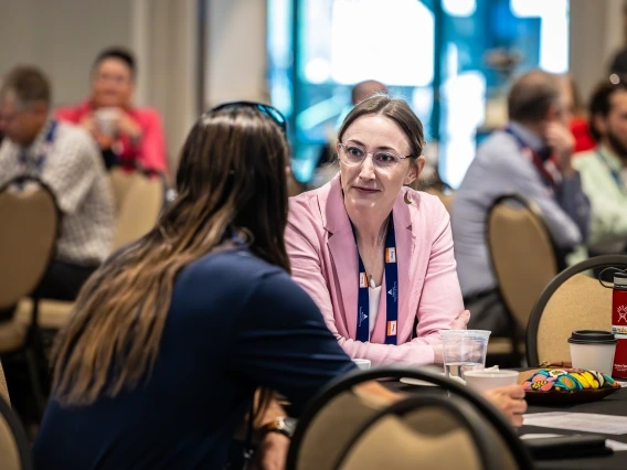 two attendees at UA Mining Social License Summit