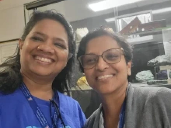 Two ladies smiling at the camera
