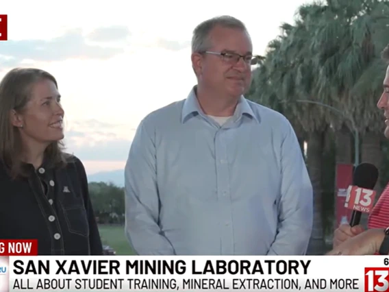 A man and a women are interviewed by a reporter