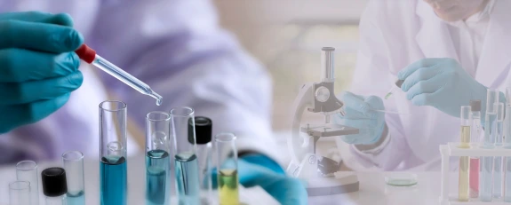 technician working in lab with test tubes
