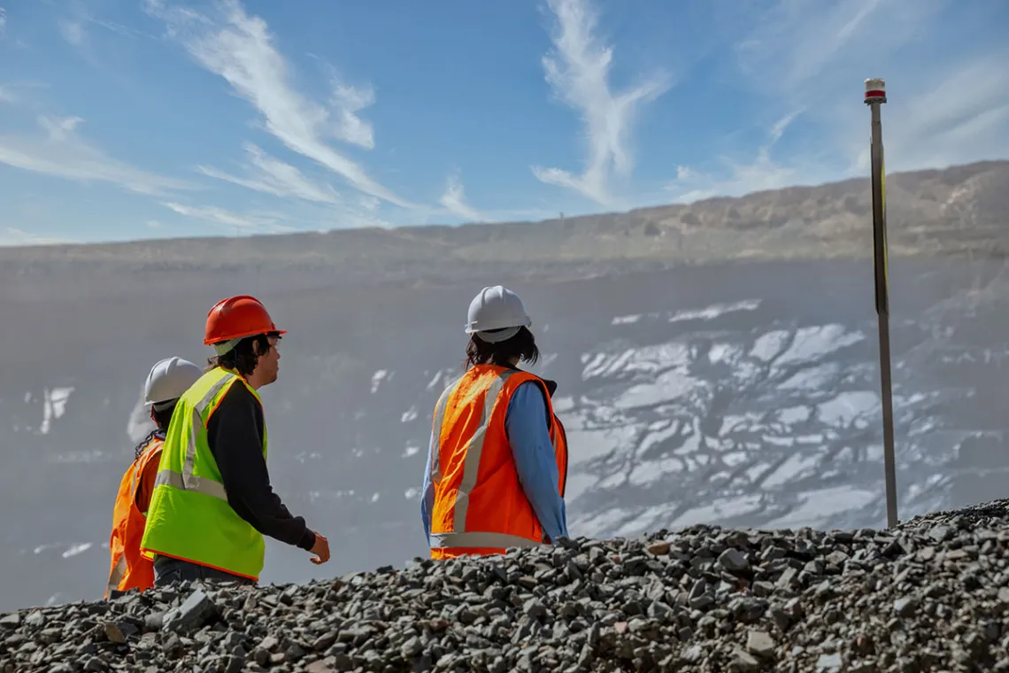Mine workers in front of a slope