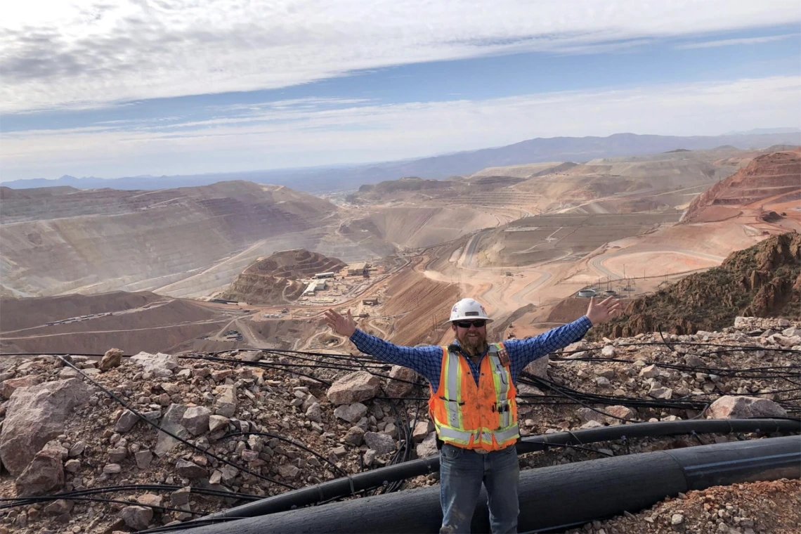 Engineer in front of open pit mine