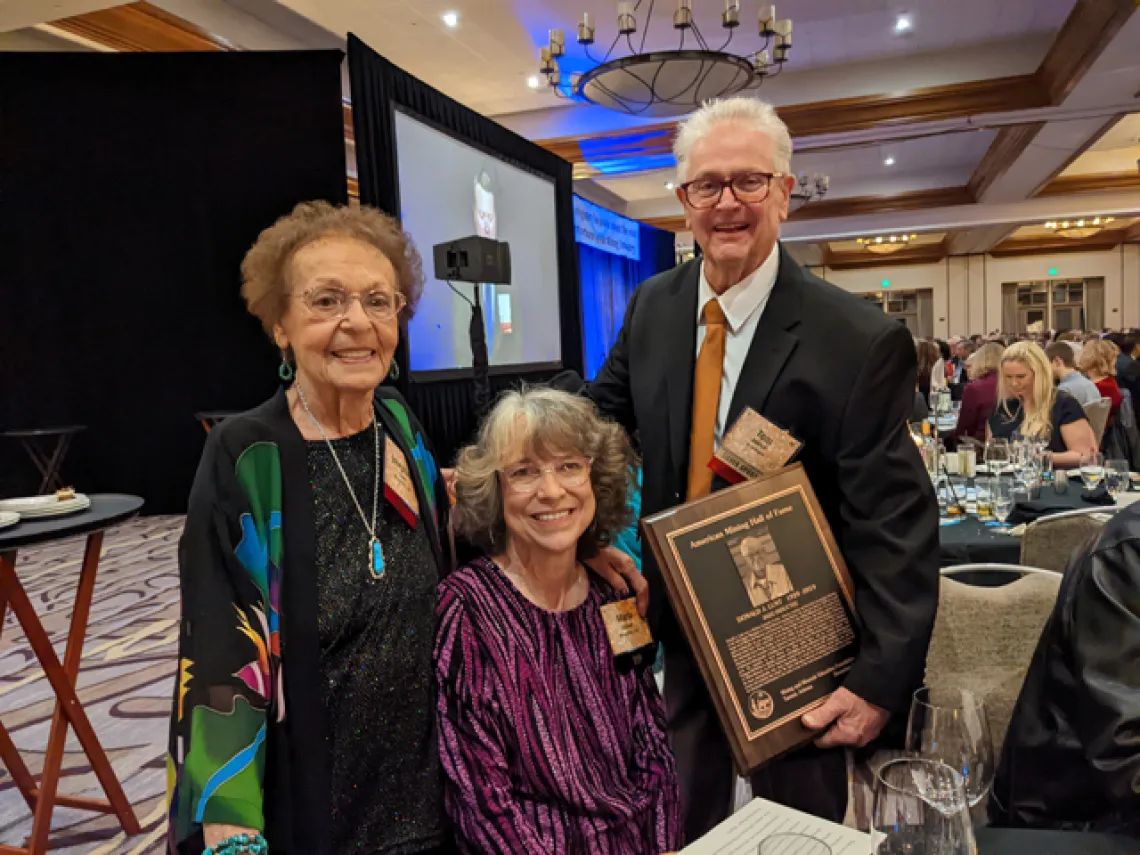 Tom Aldrich, Executive Director of MMEF presents friends and family with a Mining's Past award