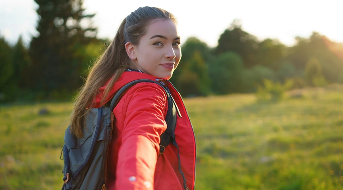 Young woman looking back over her shoulder