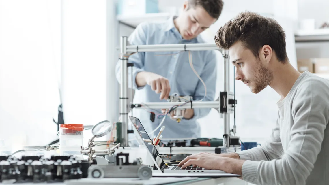 students using a 3D printer