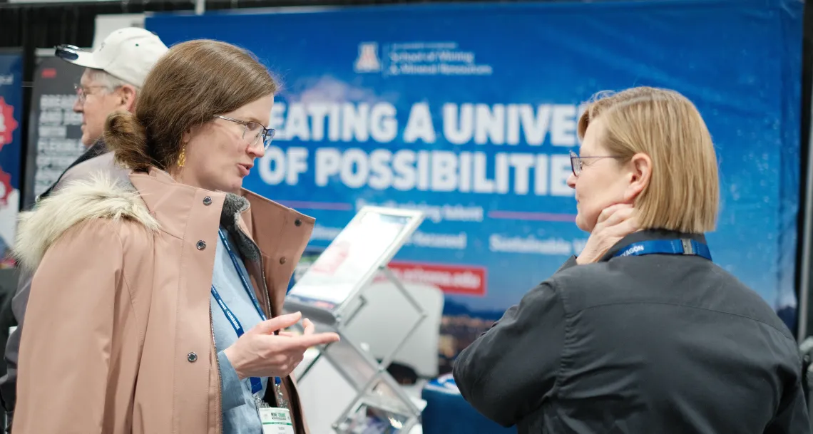 Professor Barton with DeeDee DuPlessis at booth.