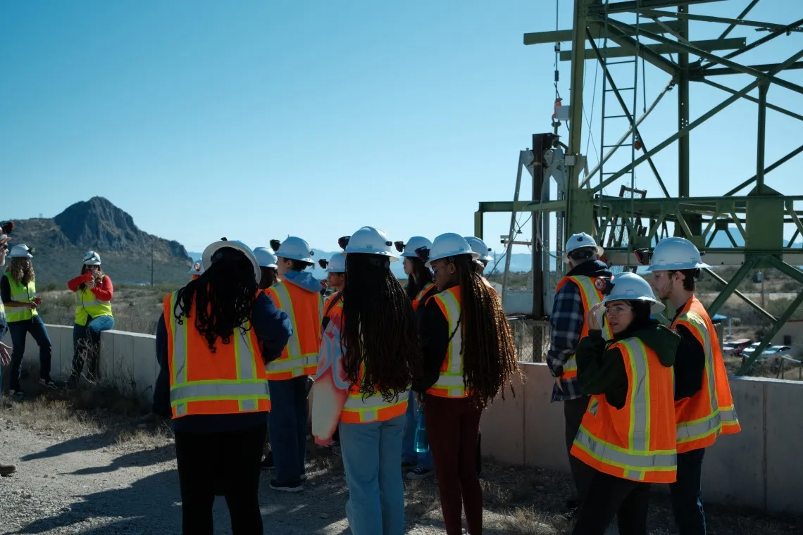 Students with mining gear at a mine