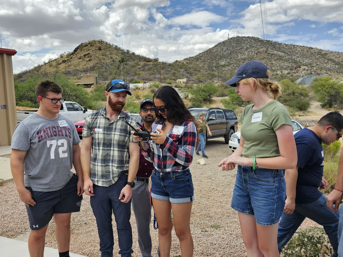 James McNabb showing drone to students at University of Arizona's SX Mine