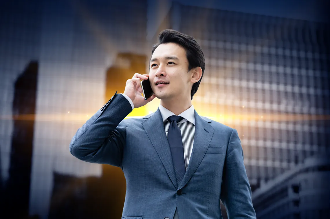 image of business man on cell phone