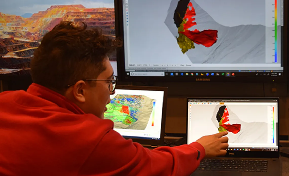 Geotechnical student looking at computer screens