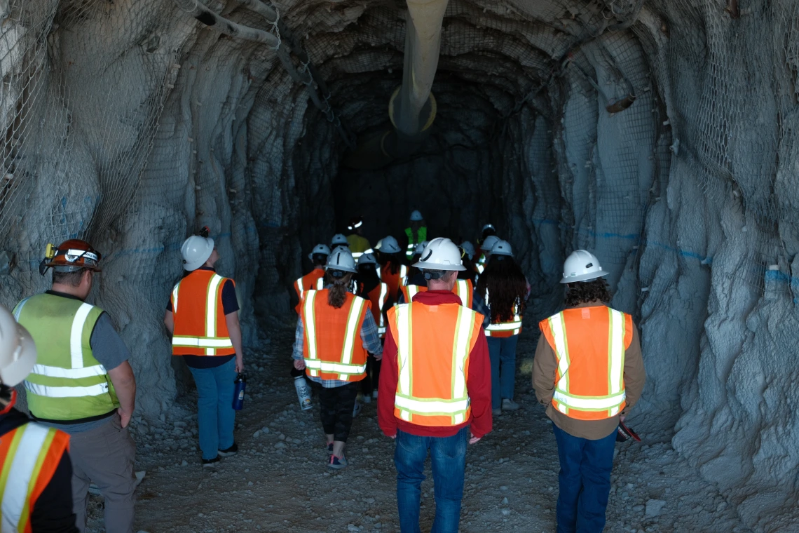 students entering into a mine