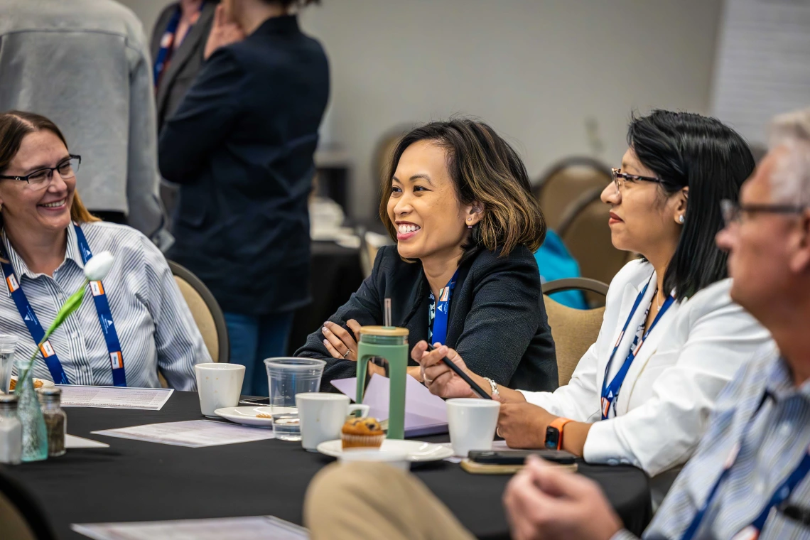 attendee smiling at Mining Social License Summit