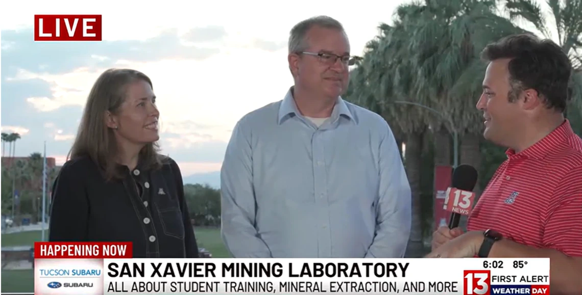 A man and a women are interviewed by a reporter