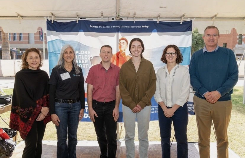 Isabel Baron (second from right) receives a scholarship for the Sustainable Mineral Resources minor at the Mines for Limitless Minds Event.