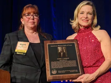 Amanda Best presents Denise C. Johnson with Hall of Fame award