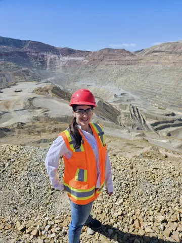 Student Teresa Billick standing near a mine