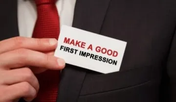 Man pulls out card that says, "make a good first impression."