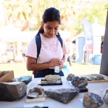 student looking at rocks