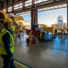 Komatsu experts Mark Schaeffer, vice president for strategy (left), and Neil Johnson, test development manager (right) in the Komatsu Arizona Proving Grounds workshop near Tucson, Arizona.